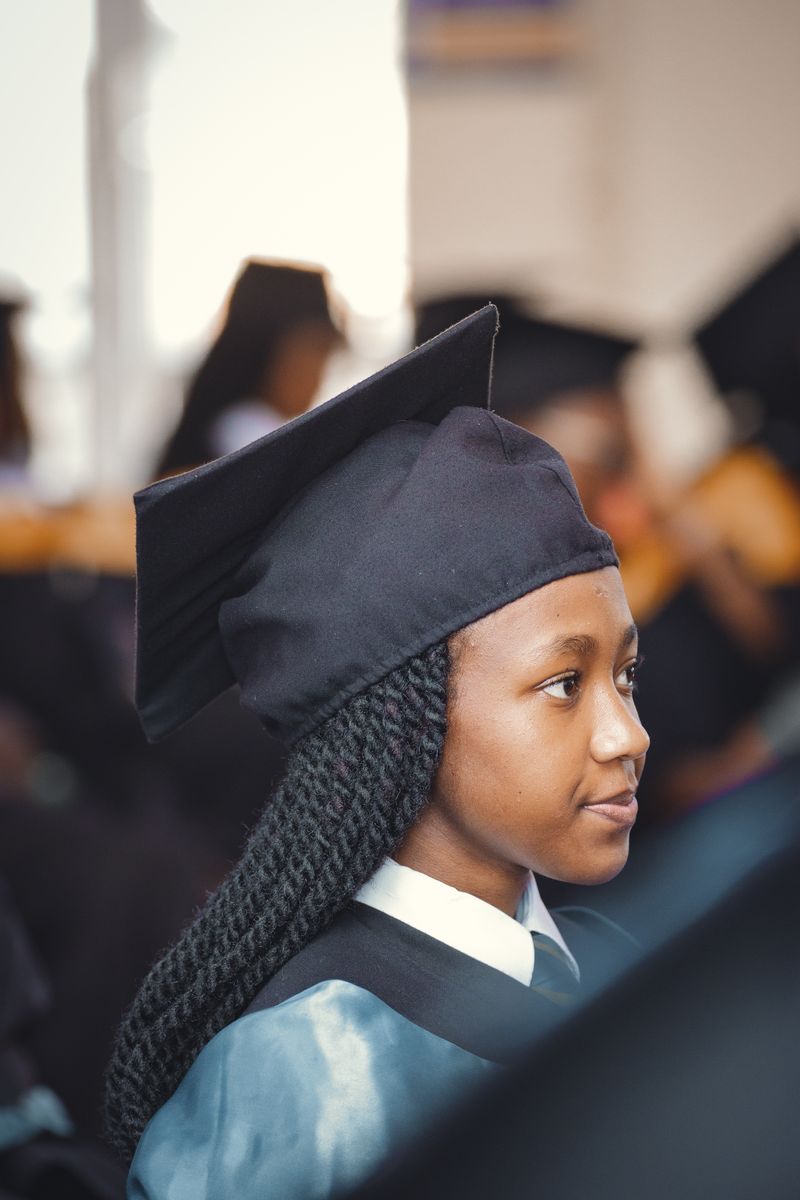 Portrait of a young graduate in cap and gown during a ceremony in Nairobi, Kenya.