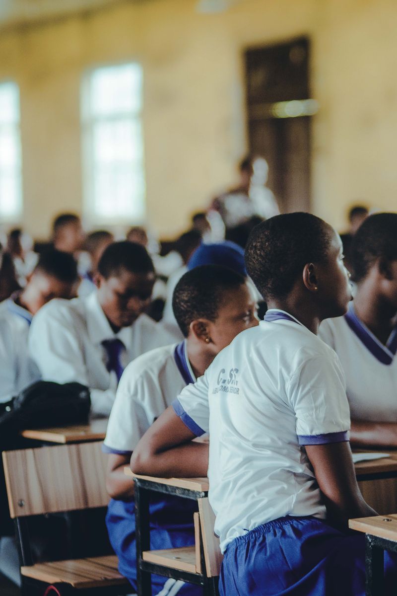 Students attentively engaged in a classroom setting, focusing on their studies.